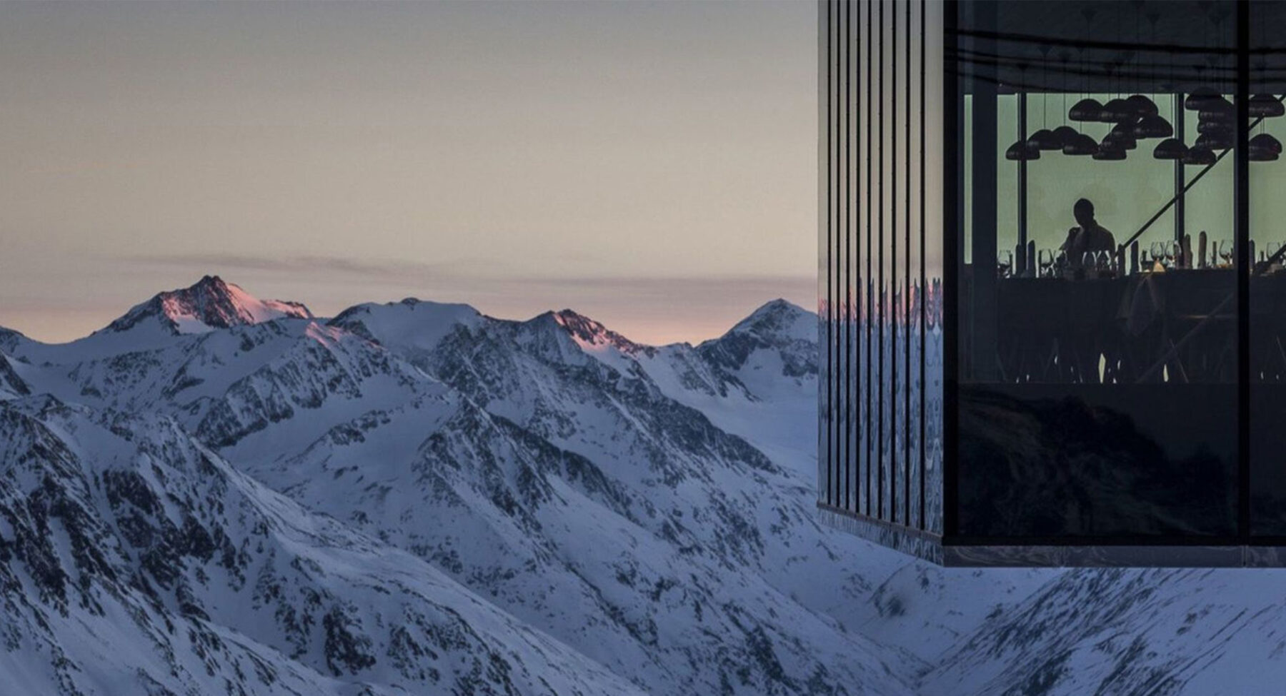 Glass-walled restaurant, perfect for luxury ski holidays